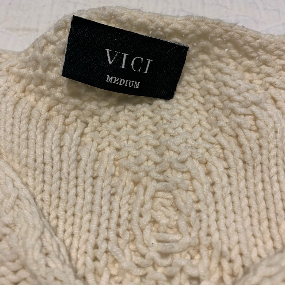 Vick  cropped sweater, longer in back. Size M